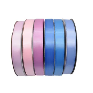 High-density polyester satin ribbon rolls in various shades of pink and blue.
