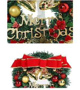 Detailed close-up view of PVC Christmas wreath with golden bells and red bow ornament