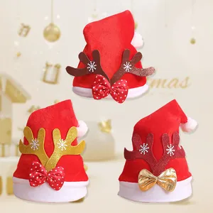 Detailed view of three red fleece Christmas hats with reindeer antlers and bows.