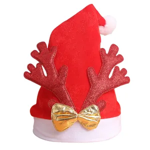 Red velvet Christmas hat featuring glittery antlers and a decorative gold bow accessory