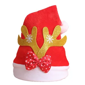 Festive red velvet Santa hat with sparkling golden reindeer antlers and polka dot bow