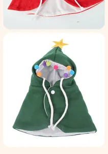 Festive green Christmas tree pet cloak featuring a yellow star and colorful pom-poms