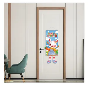 Detailed view of a cartoon rabbit Easter banner hanging on a white door for decoration.