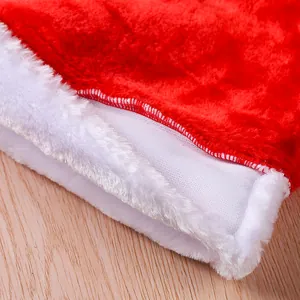 Close-up macro view of the plush white trim and red fabric stitching on a Santa hat