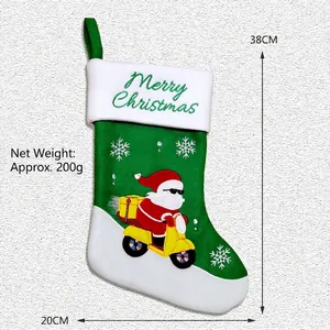 Calcetín de Navidad verde con Papá Noel en moto, altura 38 cm y anchura 20 cm