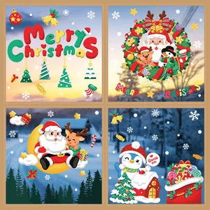 Close-up of colorful cartoon Christmas window stickers featuring Santa Claus and reindeer