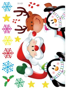 Detail view of colorful Christmas window stickers with Santa, reindeer and penguins