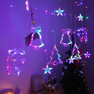 Close-up of LED curtain lights with glowing reindeer, bell, and star shapes