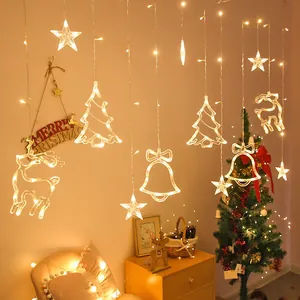 Warm LED Christmas curtain lights with stars, trees, and reindeer shapes in a cozy room setting.