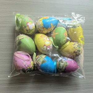 Assorted colorful hanging Easter eggs with rabbit and floral patterns in plastic bag.