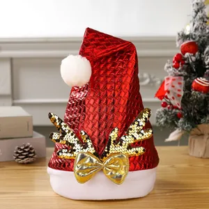 Festive red sequined Christmas hat featuring gold reindeer antlers and a shiny bow decoration
