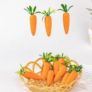 Detailed macro view of artificial Easter carrots with vibrant orange bodies and green leaves