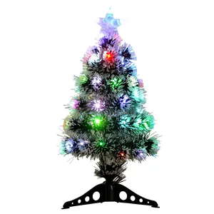 Small colorful fiber optic Christmas tree with glowing LED lights and a star topper