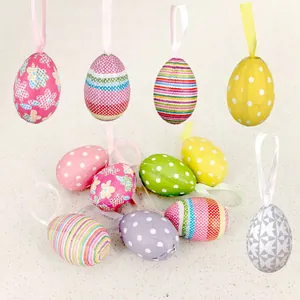 Assorted colorful foam Easter eggs with hanging ribbons for festive party decorations.