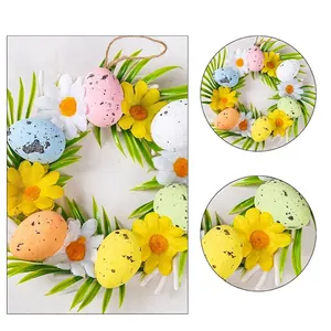 Colorful Easter wreath with speckled foam eggs and artificial daisies for decoration.