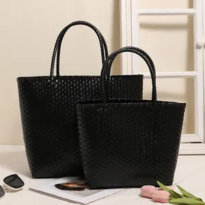 Chic black woven plastic tote bag set for beach vacations and everyday shopping