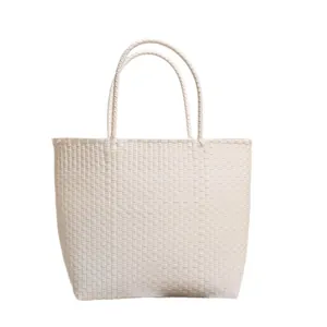 Handcrafted cream white woven plastic tote bag for seaside beach vacations and shopping