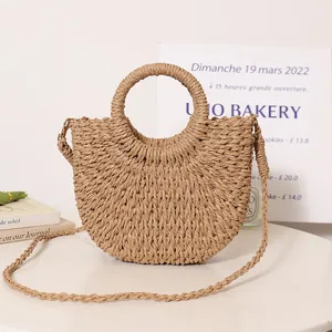 Bohemian straw woven semi-circle handbag with a round handle for beach vacation style