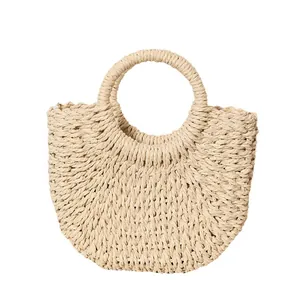 Handcrafted semi-circular straw handbag with round handle, perfect for summer beach resort style