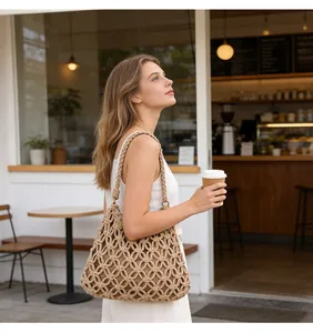 Handmade beige macrame woven shoulder bag featured in a relaxed cafe lifestyle setting