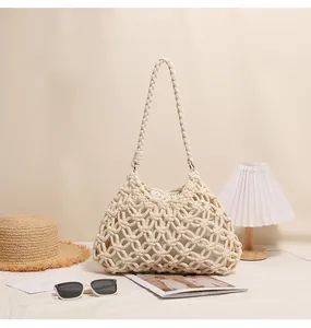 Detailed texture of hollow cotton thread woven shoulder bag for beach vacation