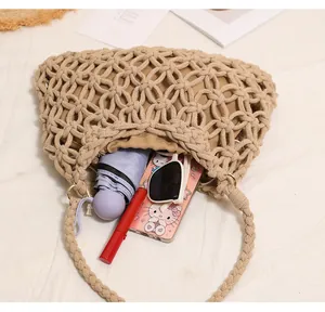 Detailed top view of a woven cotton beach bag showing its large storage capacity