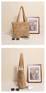 Handgehaakte stro schoudertas met bloemen en opengewerkt ontwerp voor het strand.