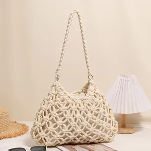 Boho hand-woven cotton rope shoulder bag with hollow-out pattern for beach vacation