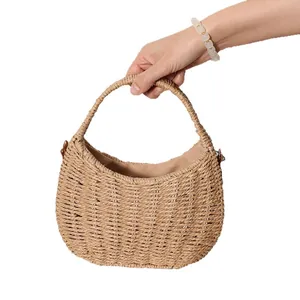 Elegant handheld crescent woven straw basket bag for summer beach holidays and leisure