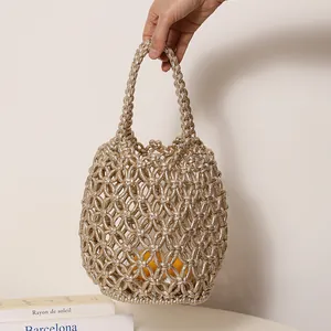 Elegante borsa a secchiello intrecciata metallica con design a rete per la spiaggia
