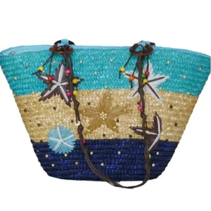Woven straw beach tote bag with colorful stars and bead accents for summer