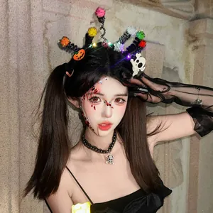 Close-up of glowing Halloween headband with colorful fuzzy sticks and spider motifs