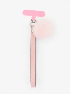 Close-up detail of a pink PU leather wrist strap featuring a soft fuzzy pom-pom charm.