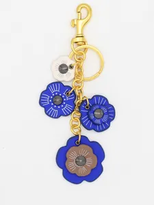 Llavero de flores de cuero PU vintage y adorno para bolso con cierre dorado