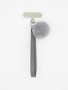 Close-up of grey PU leather phone lanyard with matching faux fur pom pom accessory