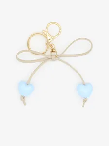 Cute beige bow keychain featuring light blue heart charms, ideal for bags and keys