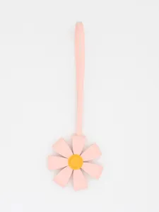 A high-quality detail view showing a cute pink PU leather 3D flower bag charm with long strap.