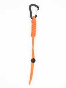 Detail of tactical orange paracord keychain with sturdy black carabiner hook