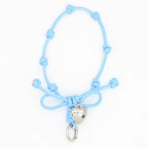 Light blue braided wrist strap phone lanyard with bow design and silver heart charm