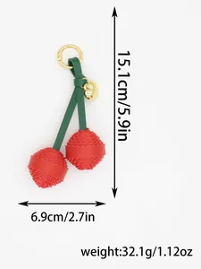 Macro view of a red PU leather cherry bag charm with precise size and weight measurements