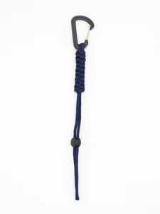 Macro detail of navy blue braided paracord lanyard attached to a black tactical carabiner