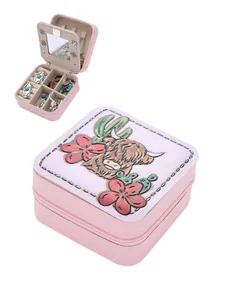 Pink PU leather jewelry box featuring embossed Highland cow design and interior mirror