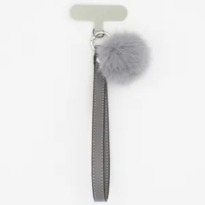 Elegant grey PU leather phone lanyard with soft faux fur pom-pom charm.