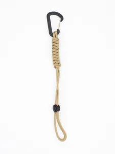 Tactical outdoor paracord lanyard detail featuring khaki cord and black carabiner hook