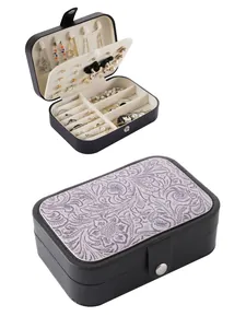 Detail of vintage Western style embossed jewelry box with multi-functional storage layout