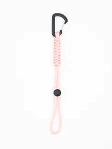 Detail of pink braided paracord lanyard with black tactical carabiner for outdoor use.