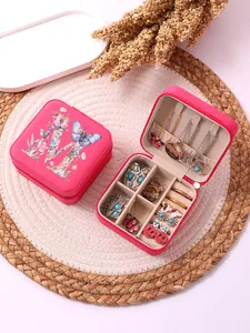 Internal and external view of a pink portable floral alphabet letter jewelry box