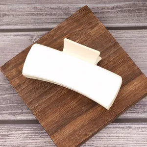Top view of a blank cream white hair claw clip with a DIY sublimation PU surface