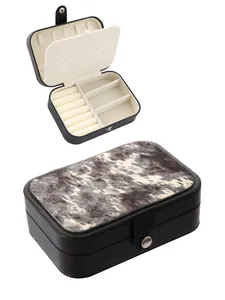 Western style cowhide print jewelry box with organized interior compartments for rings