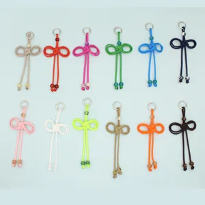 Detailed view of handmade woven PU rope keychains in various vibrant colors and beads